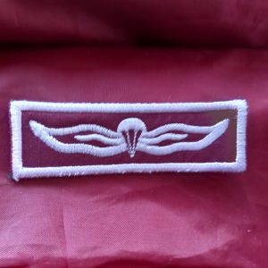 Novelty maroon and white wing